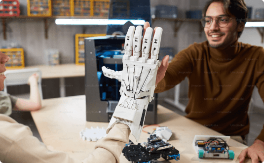 A person touches a robotic arm